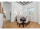 Elegant dining room featuring custom trim work and a modern chandelier at 15413 Azra Dr, Odessa, FL 33556