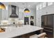 Beautiful kitchen featuring an island with a marble countertop, stainless appliances, and stylish cabinetry at 15413 Azra Dr, Odessa, FL 33556