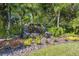 Picturesque stone waterfall feature in lush landscaping provides a serene community space at 15413 Azra Dr, Odessa, FL 33556