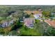 Stunning aerial view of the home nestled on a large lot with a backyard pool and lush greenery at 18244 Autumn Lake Boulevard, Hudson, FL 34667