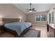Spacious bedroom with a king bed, vaulted ceilings and sliding glass doors to the pool area at 18242 Autumn Lake Boulevard, Hudson, FL 34667