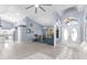 Open-concept living space with high ceilings and arched doorway with ample natural light at 18244 Autumn Lake Boulevard, Hudson, FL 34667