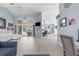 Open-concept living space with high ceilings, dining area, and sliding door access to the pool at 18244 Autumn Lake Boulevard, Hudson, FL 34667