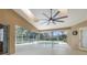 Screened patio with fan overlooking a pool with ample room for entertainment at 18242 Autumn Lake Boulevard, Hudson, FL 34667