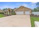Charming single-story home with a two-car garage and inviting curb appeal at 18244 Autumn Lake Boulevard, Hudson, FL 34667