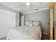 Bedroom with ceiling fan, closet, and vintage wardrobe at 18520 Hidden Pines Way, Hudson, FL 34667