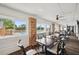 Bright dining area with large windows overlooking the pool, perfect for community gatherings at 18520 Hidden Pines Way, Hudson, FL 34667
