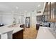 Bright kitchen showcasing updated appliances, tile flooring, and ample counter space at 18520 Hidden Pines Way, Hudson, FL 34667