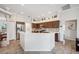 Modern kitchen featuring stainless steel appliances, mosaic tile backsplash, and a breakfast bar at 18520 Hidden Pines Way, Hudson, FL 34667