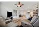 Spacious living area showcasing an open-concept design, connecting the kitchen and dining spaces at 18520 Hidden Pines Way, Hudson, FL 34667