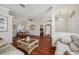 Open concept living room with hardwood floors and natural lighting at 18520 Hidden Pines Way, Hudson, FL 34667