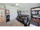 A well-organized office with storage, a comfortable sofa, and plenty of workspace for all your needs at 18520 Hidden Pines Way, Hudson, FL 34667