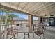 Spacious outdoor patio with tables and chairs, perfect for enjoying outdoor views at 18520 Hidden Pines Way, Hudson, FL 34667