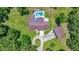 Aerial view of the home, featuring a pool, spacious backyard, and detached garage at 21000 Exeter Ct, Brooksville, FL 34601