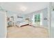 Bright bedroom features a neutral palette, desk, and views to the outdoors at 21000 Exeter Ct, Brooksville, FL 34601