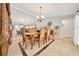Bright dining room with large mirror, elegant table, and chairs, perfect for entertaining guests at 21000 Exeter Ct, Brooksville, FL 34601