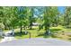 View of the pillars with a fence alongside a long driveway leading to a house at 21000 Exeter Ct, Brooksville, FL 34601