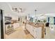 Bright, open kitchen featuring tile floors, white cabinets, granite countertops, and stainless steel appliances at 21000 Exeter Ct, Brooksville, FL 34601