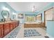Bright main bathroom featuring a large vanity, tiled floors, a soaking tub, and a separate shower at 21000 Exeter Ct, Brooksville, FL 34601