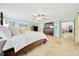 Open main bedroom with a view to dining room, tv, and tiled floors for an airy, spacious feel at 21000 Exeter Ct, Brooksville, FL 34601