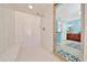Walk-in shower in main bath with tiled walls, built-in bench, and easy access, enhances this space at 21000 Exeter Ct, Brooksville, FL 34601