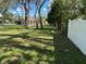 Large backyard with a mix of open lawn space and mature shade trees at 2158 Clayton Ave, Spring Hill, FL 34609