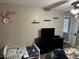 Bright bedroom featuring a dresser, shelves, bed, and a ceiling fan at 2158 Clayton Ave, Spring Hill, FL 34609