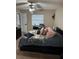 Comfortable bedroom with floral bedding, ceiling fan, and good natural light at 2158 Clayton Ave, Spring Hill, FL 34609