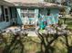 Outdoor patio area with seating and a view of the landscaped backyard at 2158 Clayton Ave, Spring Hill, FL 34609