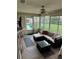 Enclosed sunroom with comfortable seating and bright natural light at 2158 Clayton Ave, Spring Hill, FL 34609