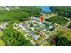 Aerial view of neighborhood showing proximity to nearby lake, trees, and community at 21820 Carson Dr, Land O Lakes, FL 34639