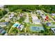 A residential neighborhood featuring tennis courts, swimming pools, and beautiful landscaping at 21820 Carson Dr, Land O Lakes, FL 34639