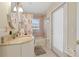 Cozy bathroom features a shower-tub combination and natural light from the window at 21820 Carson Dr, Land O Lakes, FL 34639