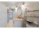 Bright bathroom with vanity, sink, shelving, and a view to a bedroom at 21820 Carson Dr, Land O Lakes, FL 34639
