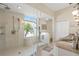 Modern bathroom features a glass shower, tiled walls, and a window with a view at 21820 Carson Dr, Land O Lakes, FL 34639