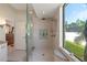 Contemporary bathroom showcasing a glass shower, sleek fixtures, and a bright, airy feel at 21820 Carson Dr, Land O Lakes, FL 34639
