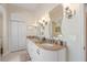 Elegant bathroom with double sinks, granite countertops, and ample cabinet space, providing a luxurious feel at 21820 Carson Dr, Land O Lakes, FL 34639