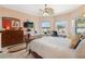 Comfortable bedroom featuring a ceiling fan, large windows, and ample space for furniture, perfect for relaxation at 21820 Carson Dr, Land O Lakes, FL 34639