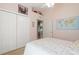 Comfortable bedroom features a double door closet, ceiling fan, and a world map at 21820 Carson Dr, Land O Lakes, FL 34639