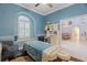 Inviting room with arched window, a built-in desk, and access to the dining room at 21820 Carson Dr, Land O Lakes, FL 34639