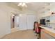 This bedroom features a ceiling fan, closet, desk and an attached bath at 21820 Carson Dr, Land O Lakes, FL 34639