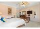 Cozy bedroom featuring a ceiling fan, neutral walls, and ample space for furniture, creating a relaxing atmosphere at 21820 Carson Dr, Land O Lakes, FL 34639