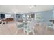Community room featuring several tables and chairs with couches in the background at 21820 Carson Dr, Land O Lakes, FL 34639