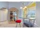 Cozy dining area with large window overlooking the lanai and pool at 21820 Carson Dr, Land O Lakes, FL 34639