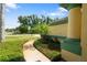 Lush front yard landscaping with walkway leads to the entrance of the home at 21820 Carson Dr, Land O Lakes, FL 34639