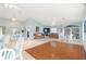Spacious living area with comfortable seating, a bookcase and plenty of natural light at 21820 Carson Dr, Land O Lakes, FL 34639