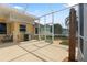 Covered patio featuring an outdoor shower, grill, and seating area at 21820 Carson Dr, Land O Lakes, FL 34639