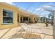Spacious screened-in patio features lounge chairs for relaxing and outdoor living at 21820 Carson Dr, Land O Lakes, FL 34639