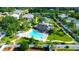 Aerial shot of a screened pool area with ample lounge space and lush landscaping, great for relaxing at 21820 Carson Dr, Land O Lakes, FL 34639