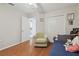 Bright bedroom with wood floors, chair and closet space, offering a comfortable retreat at 22431 Willow Lakes Dr, Lutz, FL 33549
